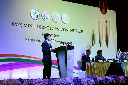 Dr Bo Deng presents a machine developed for the visual checking of large quantities of commemorative coins. Photograph: Mint of Thailand.