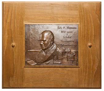 The portrait plaque in memory of Eric Pfeiffer Newman's 100th birthday.
