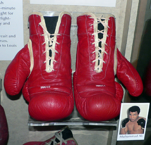 A pair of Muhammad Ali's boxing gloves, on display at the National Museum of American History, Washington, DC. Photo: Mark Pellegrini / Wikipedia. Creative Commons CC-BY-SA-2.5.